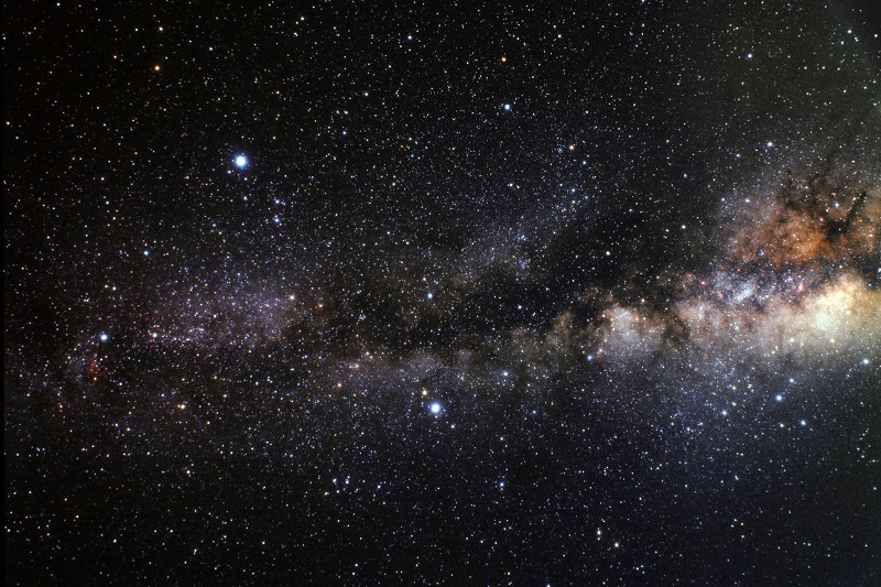 The Milky Way galaxy stretches across a dark star-filled sky 
