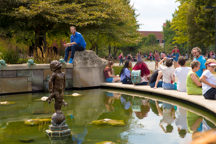 students and families at Frog Baby fountain