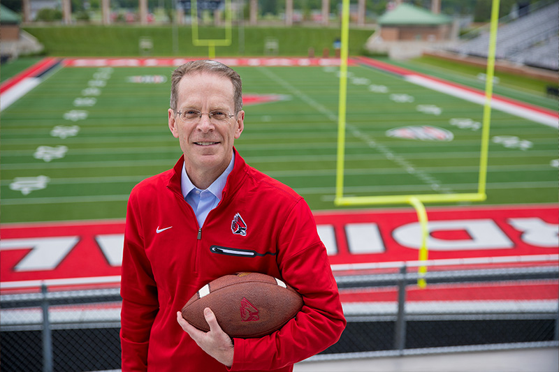 President Mearns holding football