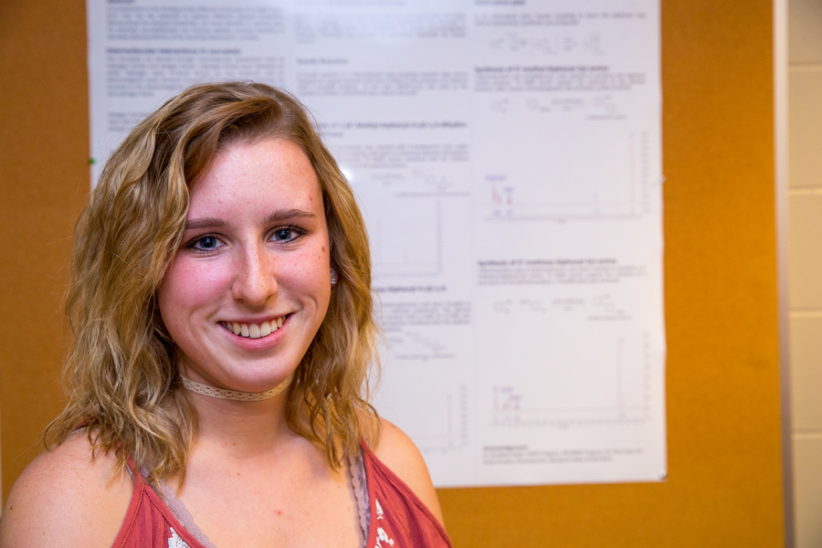 student at a poster presentation