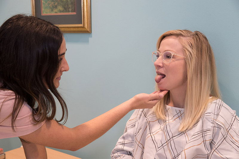 A Speech Pathology student works with a client