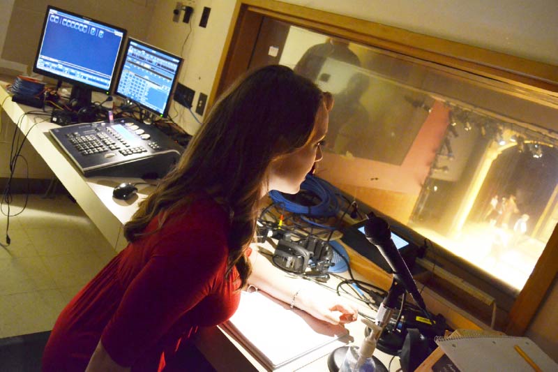 Student working in a theatre booth.