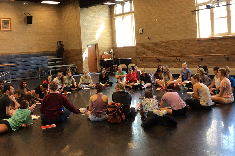 students site in a circle inside korsgaard dance studio