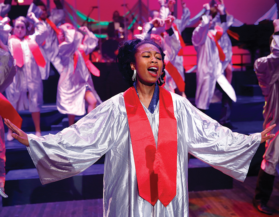 singers in Emens Auditorium