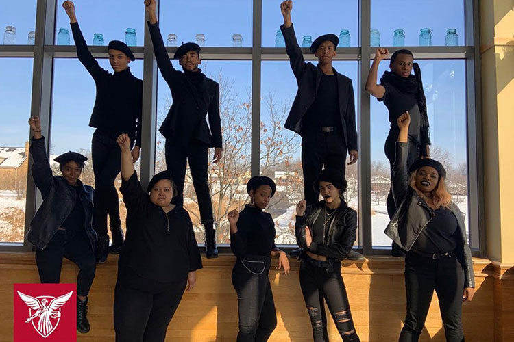 Immanuel Simon poses with other students