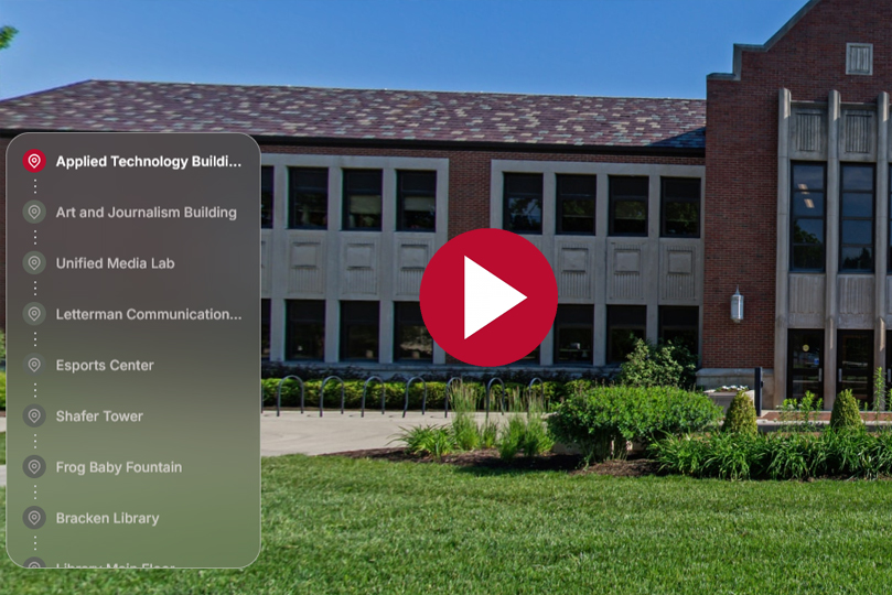 Tour screenshot of the applied technology building for a menu on the left and a play button in the center with a building in the background