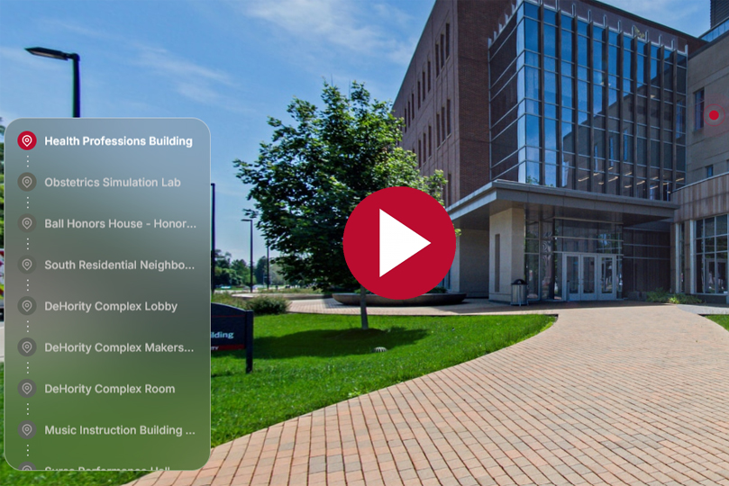 tour screenshot of the health professions building with a menu on the left, a play button in the center and a brick building in the background