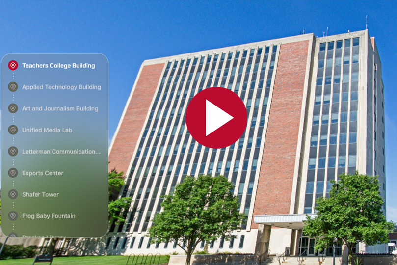 tour screenshot of teachers college building, a menu on the left, a play button in the center and a building in the background