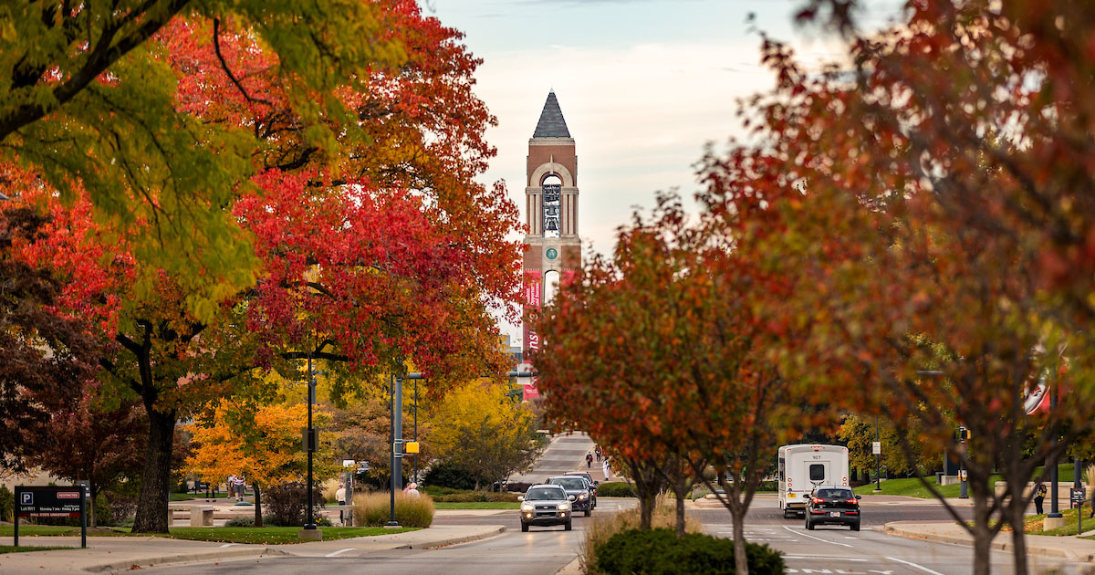 Ball State Bell Tower surrounded by fall-colored trees