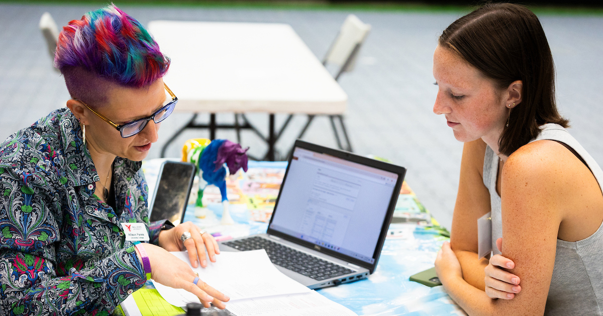 ball state advisor chatting with a student