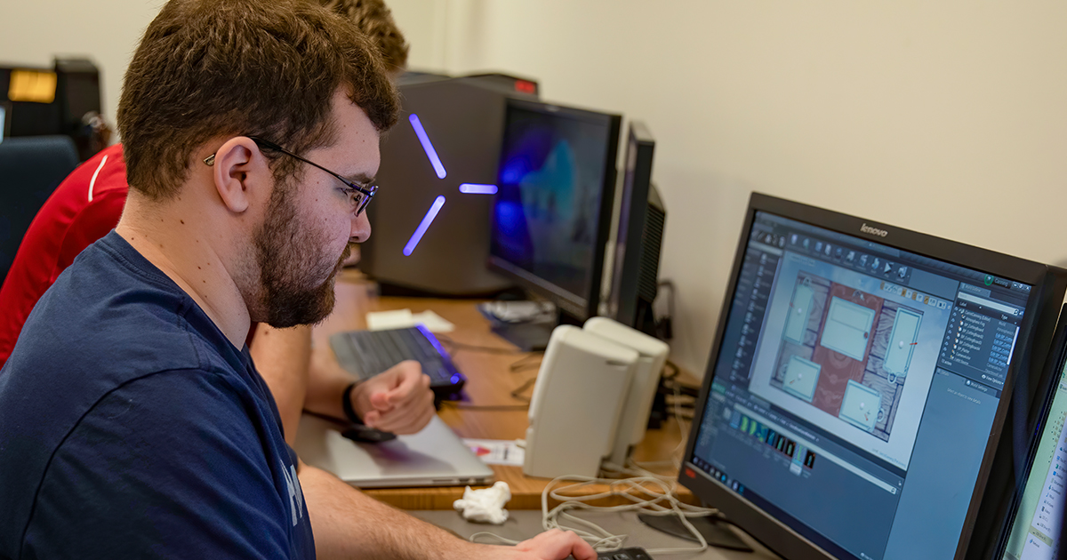 A computer science student working on a computer