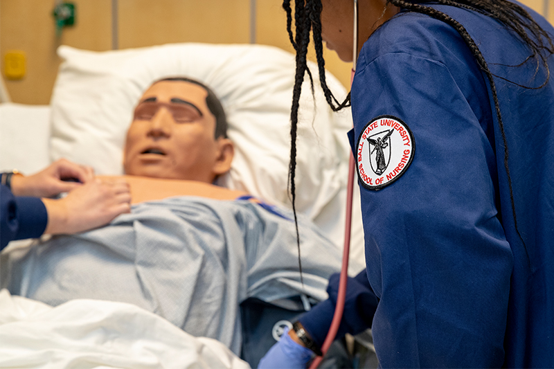 Nursing students work on a manikin in the Clinical Sim Lab