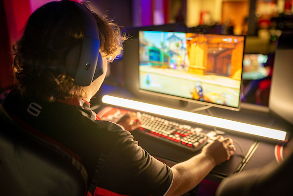 student playing a game in the esports lounge