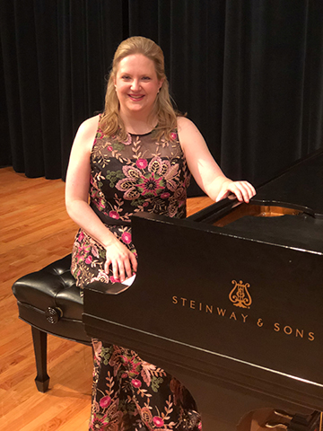 Pianist Ellen Elder poses with a Steinway & Sons piano