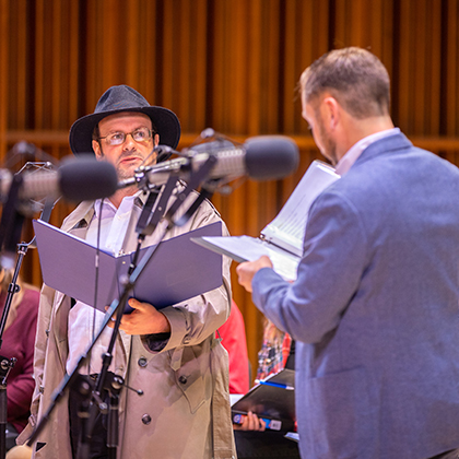 The cast of A CHRISMYSTERY performing onstage in Sursa Hall