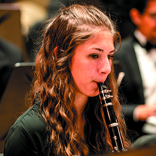 A clarinetist performing on stage