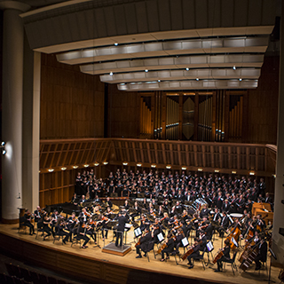 The Ball State Symphony Orchestra performing in Sursa Hall with chorus