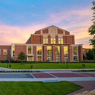 The outside of Sursa Performance Hall at sunset