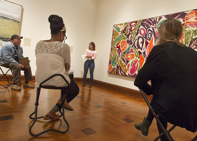 Student Alyson Walbridge introduces Lee Krasner's painting Right Bird Left to the accompaniment of Leon Kirchner's Flutings for Paula.