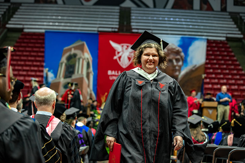 Graduate returning with diploma