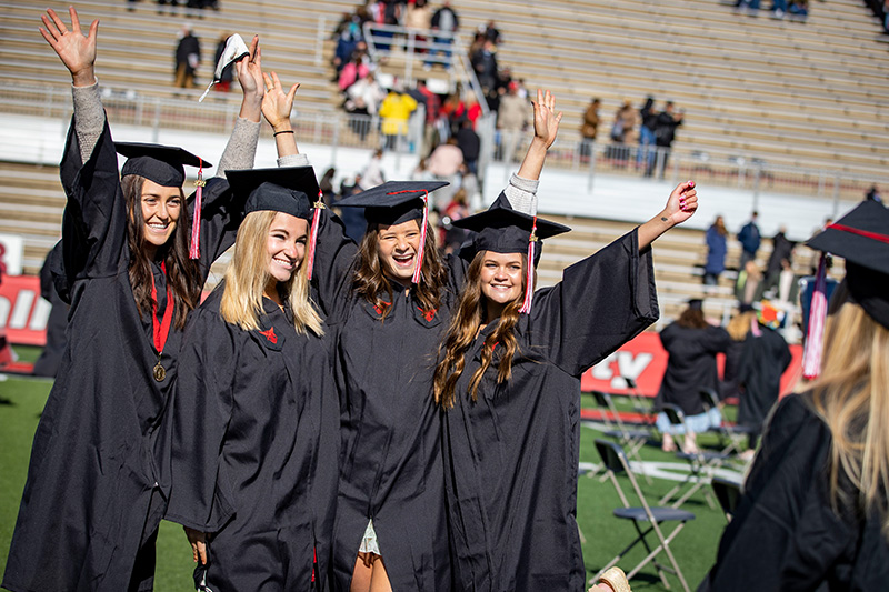 Group of students waving