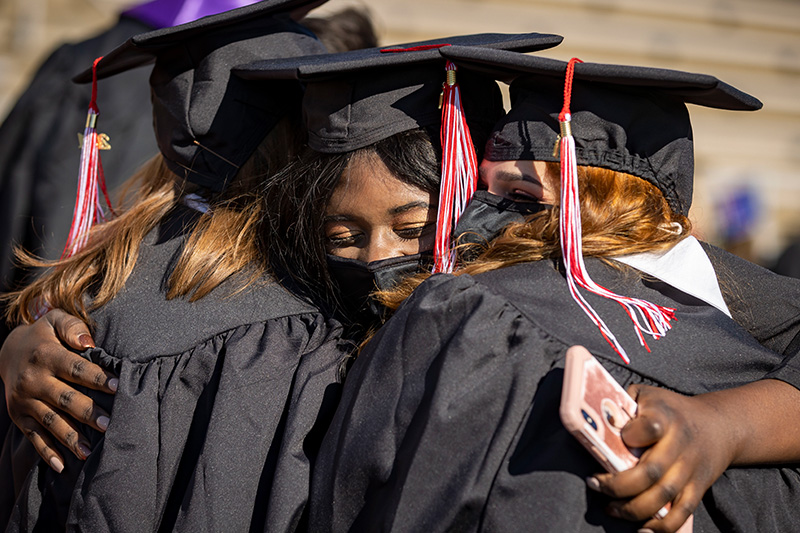 Graduates hugging