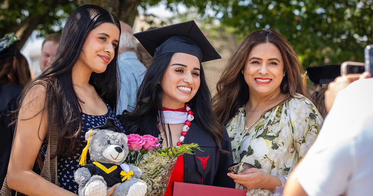 Graduate and their family gets their photo taken