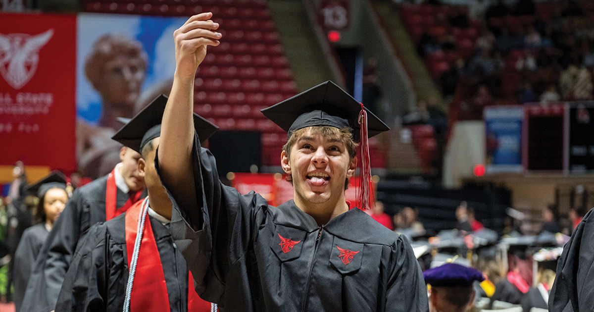 Student celebrating after receiving diploma