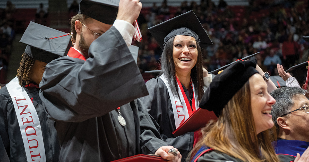 Students celebrating at their seats
