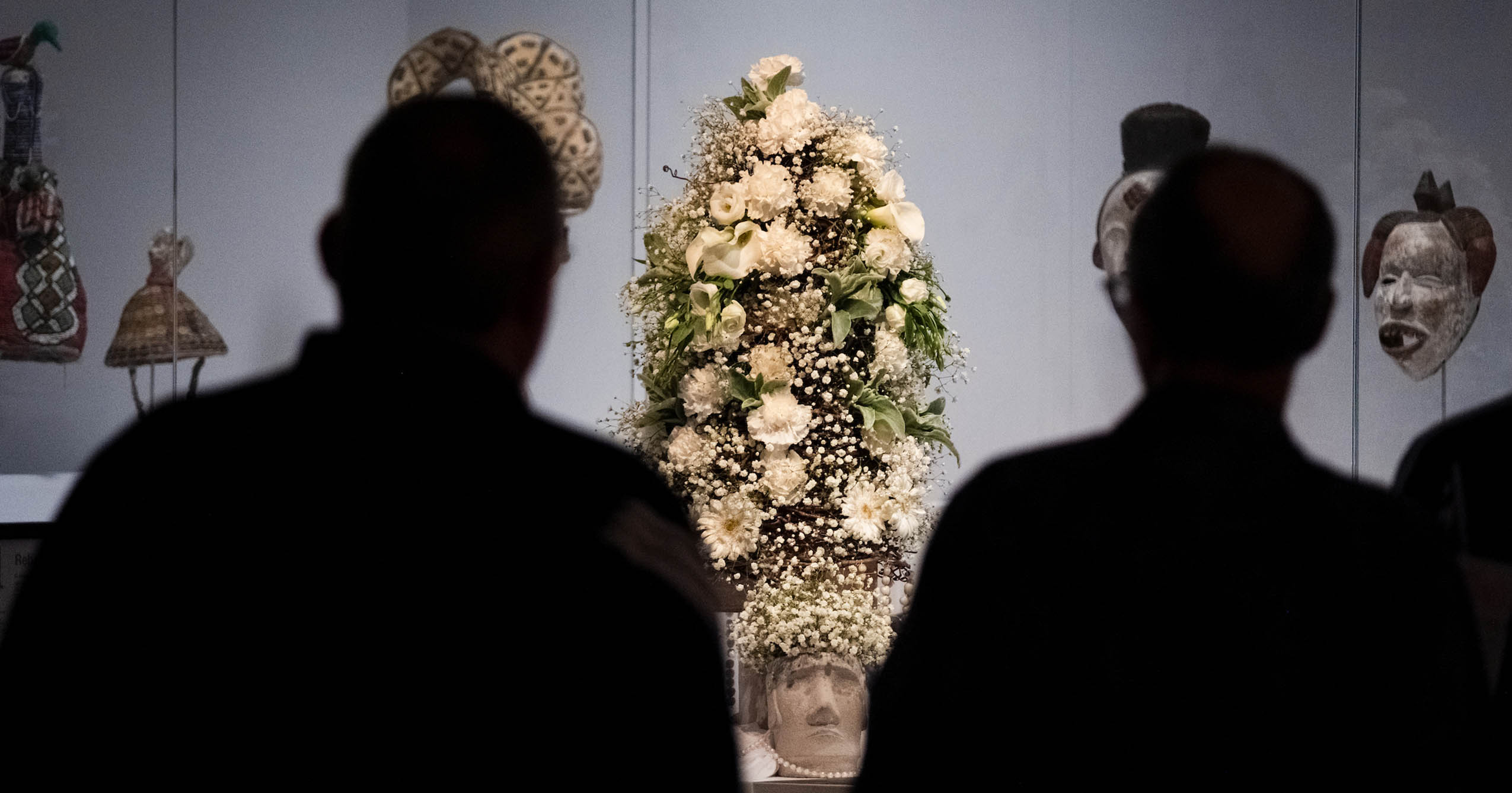Visitors view a floral arrangement inspired by artwork during the 2025 Art in Bloom event at the David Owsley Museum of Art.