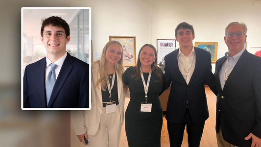 DJ Kitson’s professional headshot appears beside a group photo of four people dressed in business attire standing together at an event.